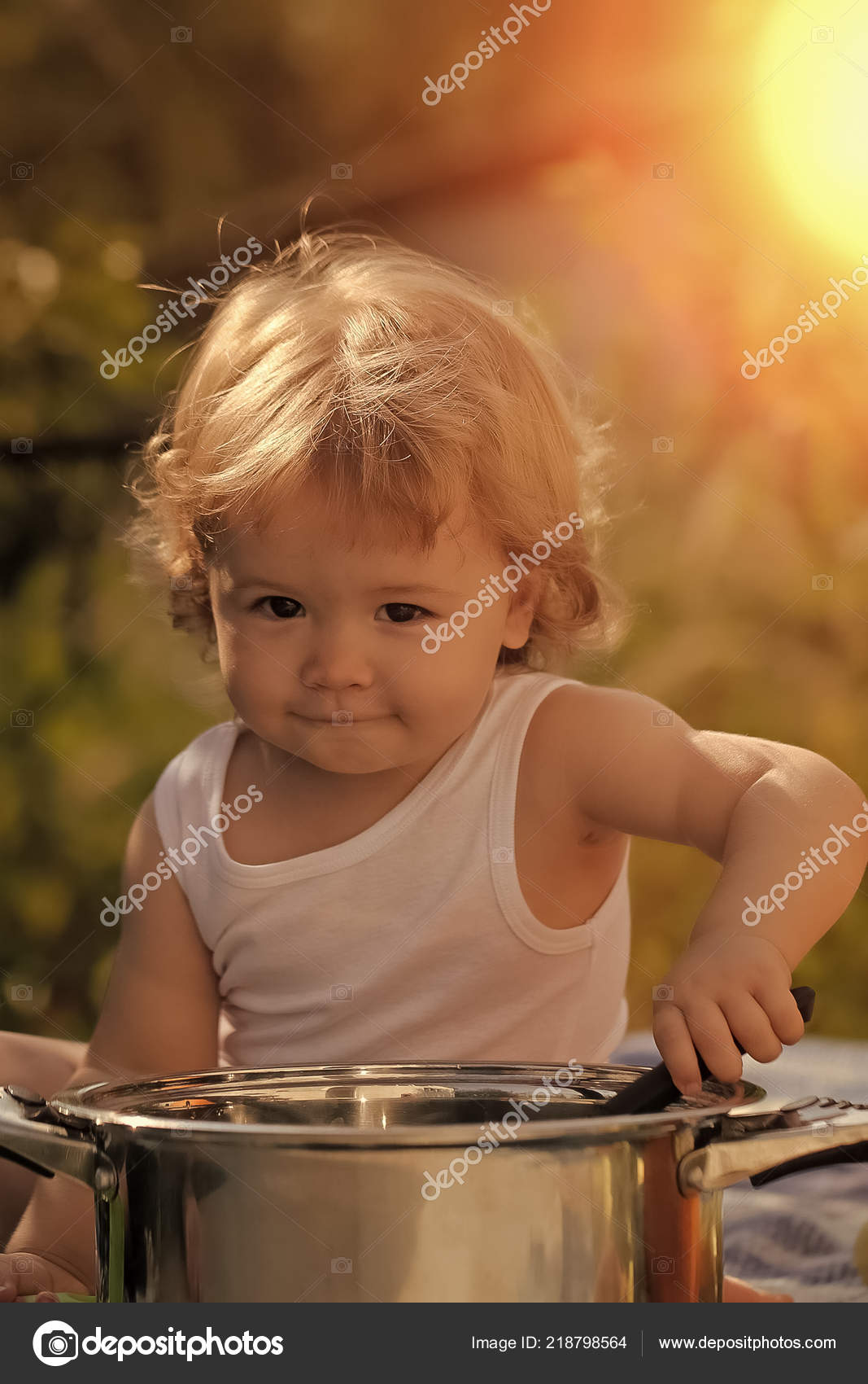 Child Outdoor Portrait Of Smiling Baby Boy With Blonde Curly Hair