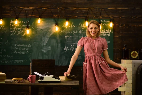 college time with happy retro woman in classroom. college education in modern life. college woman at work palce with smiling face.