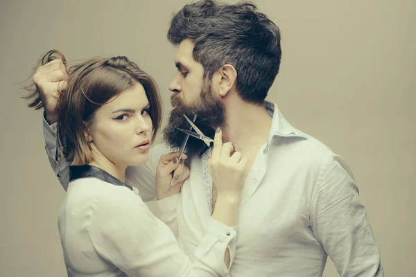 Beard makes your appearance more masculine and brutal. Beard care tricks keep facial hair look resplendent. Masculinity concept. Girl barber with scissors cutting beard hair brutal bearded hipster — Stock Photo, Image