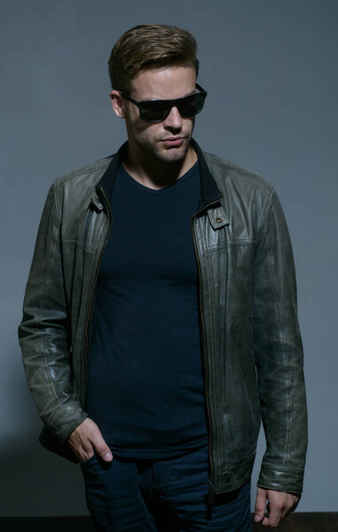 My glasses as unique as me. Fashion eyewear. Handsome man wear eye glasses. Fashion model in trendy sun glasses. Man of fashion. Masculine and powerful