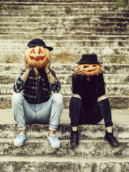 Halloween couple with pumpkin — Stock Photo, Image