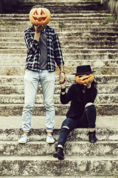 Halloween couple with pumpkin — Stock Photo, Image