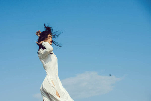 Fashion model on blue sky background.