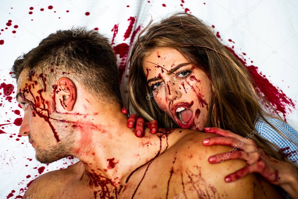 Bloody halloween couple in love. Halloween party art design. Sexy Vampire couple with blood.