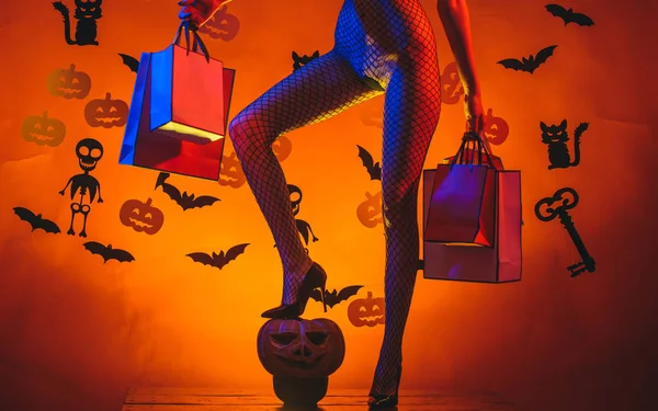 Female with sexy ass posing on pumpkin. Erotic lady fashion concept. Autumn time for Fashion sale. Halloween poster with pumpkins. Secrets of Magic for Happy Halloween. — Zdjęcie stockowe