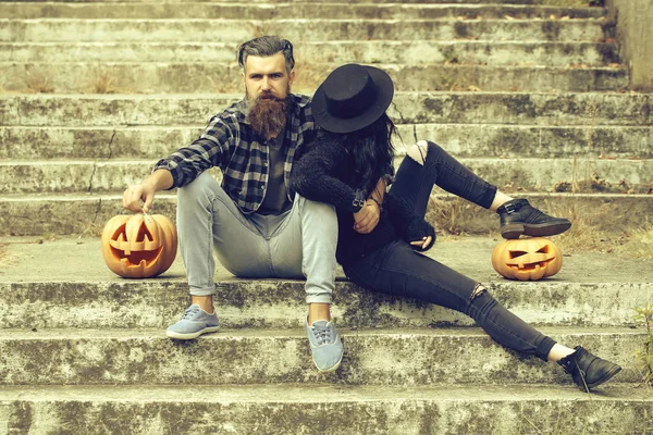 Halloween couple with pumpkin — Stock Photo, Image