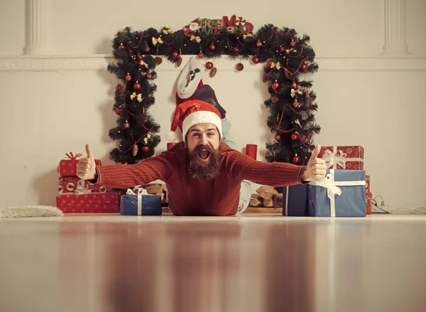 Christmas man with beard on happy face at present box.