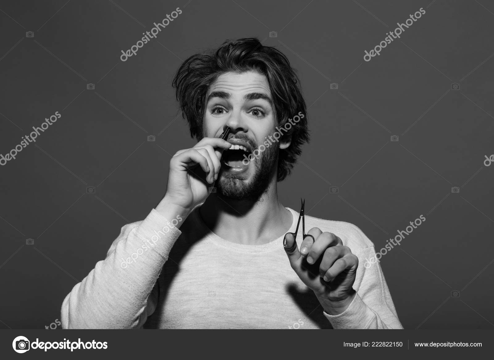 Man Barber Twitch Nose Hair With Tweezers And Hold Scissors