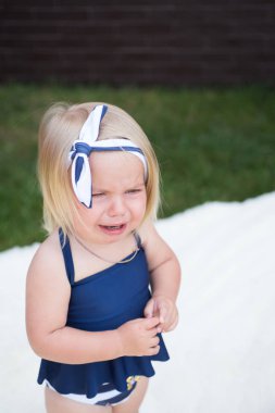 Oh no. Unhappy girl child with blond hair. Small girl crying outdoor. Small child wear stylish headband in hair. Hair accessory. Totally a pretty way to wear a headband clipart