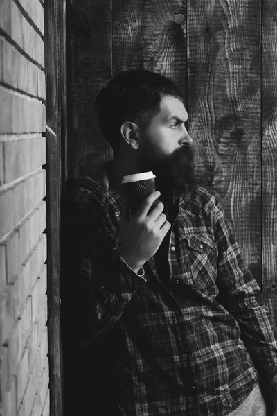 Hipster standing with blue plastic cup — Stock Photo, Image