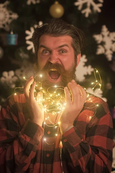 New year guy with illuminated wire. — Stock Photo, Image