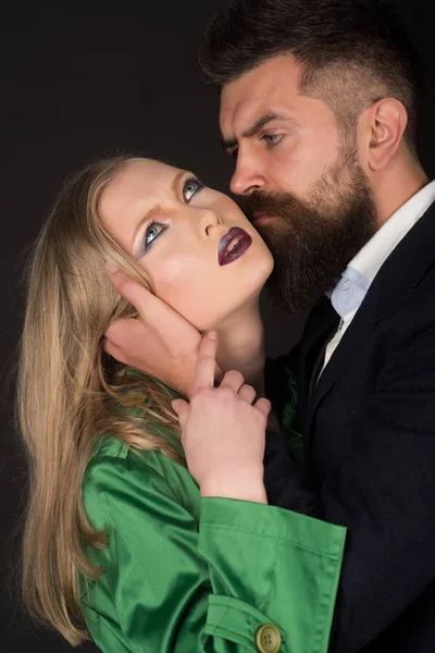 Feeling of emotional closeness. Style icons. Couple in love. Bearded man hug woman with long hair. Intimate couple in fashion clothing. Fashion style and hair care. They both love fashion — Stock Image Feeling of emotional closeness. Style icons. Couple in love. Bearded man hug woman with long hair. Intimate couple in fashion clothing. Fashion style and hair care. They both love fashion Royalty Free Stock Images