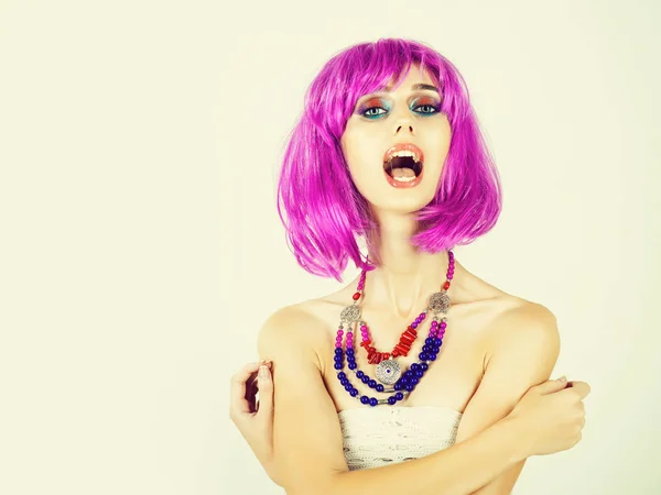 Girl with bright artificial hair in ethnic jewelry. — Stock Photo, Image