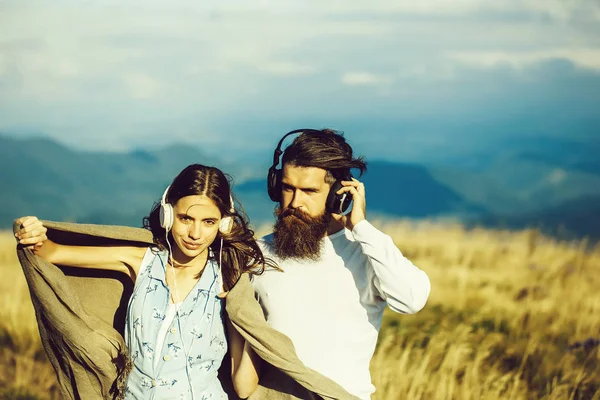 Young couple with headphones — Stock Photo, Image