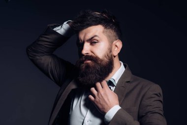 Fashion is not art but business. Man with long beard in business wear. Business as usual. Bearded man after barber shop. Mens fashion. No barber shaves so close clipart