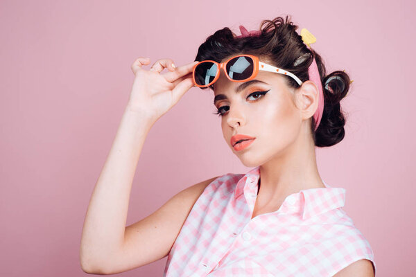 Pin up girl. retro woman with fashion makeup. beauty salon and hairdresser. happy girl in summer glasses. vintage housewife woman make hairstyle. Confident and stylish beauty. Beautiful female