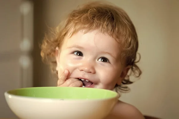 Portrait of little baby boy eating — Stock Photo, Image