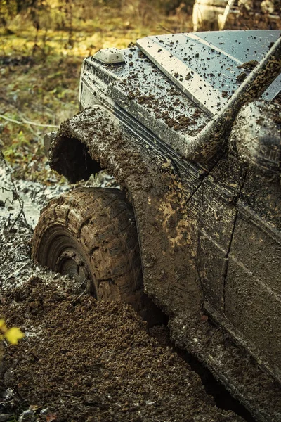 Fragment of car stuck in dirt, close up. — Stock Photo, Image