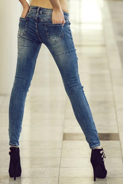 Fashionable woman or girl in blue jeans and shoes — Stock Photo, Image