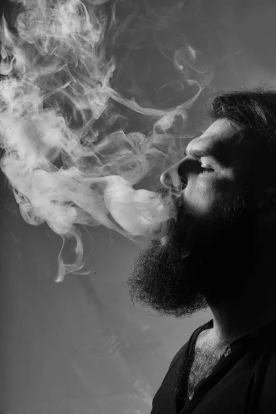 Bearded man with smoke — Stock Photo, Image