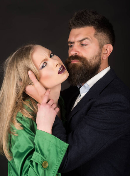 Deepening the love and intimacy. Style icons. They both love fashion. Couple in love. Bearded man hug woman with long hair. Intimate couple in fashion clothing. Fashion style and hair care