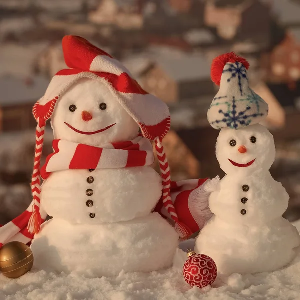 Snowmen on countryside background — Stock Photo, Image