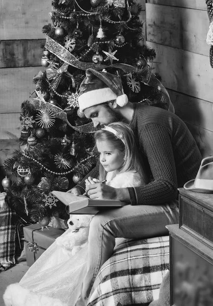 Christmas bearded father and girl writting — Stock Photo, Image