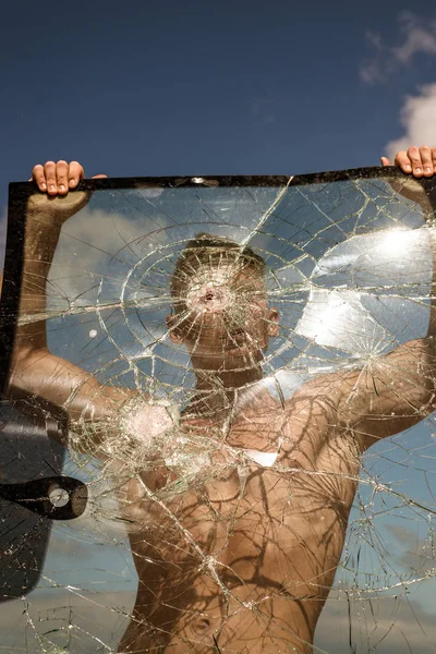 His great ambition is to become a champion. Sport man with muscular strength. Achieving sport ambition with right workout. Strong man hold cracked glass. Focus on building strength and power — Stock Photo, Image