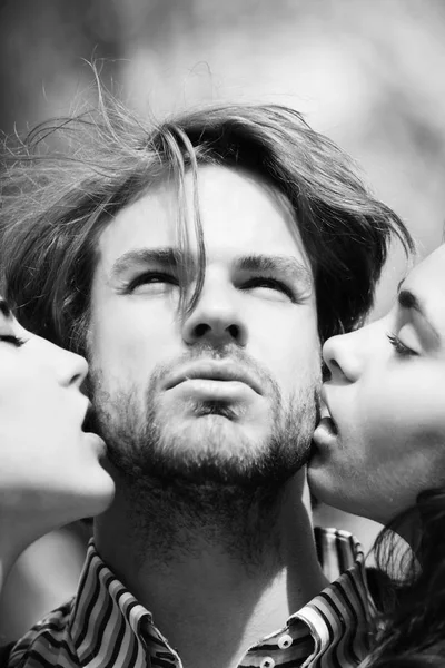 People, man getting kiss by two adorable girls — Stock Photo, Image