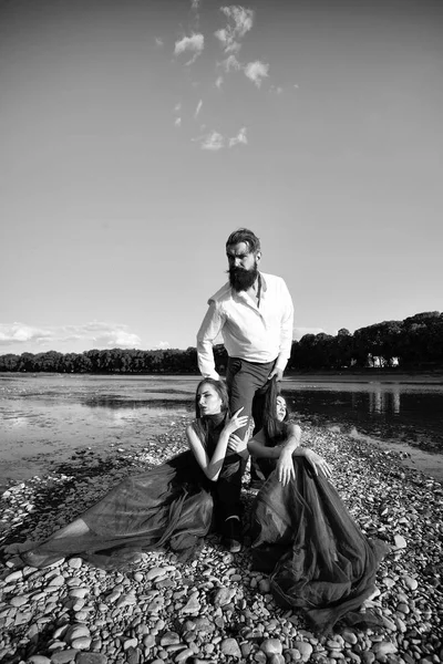 Bearded man and two women outdoor