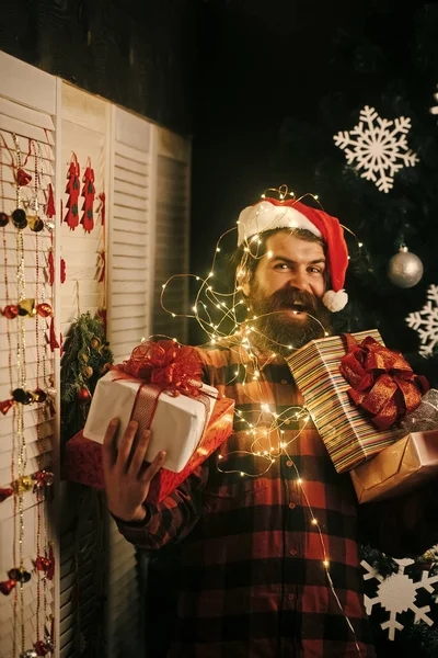 Christmas man with beard on happy face and garland. — Stock Photo, Image