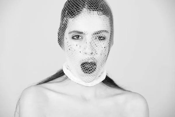 Young girl with face in stylish fishnet stocking — Stock Photo, Image