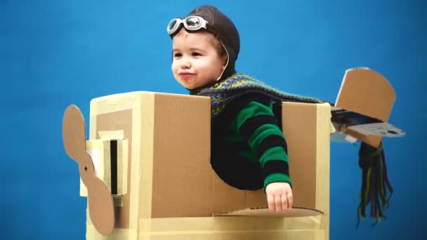 Cute little boy and daddy. child is dressed in pilot costume. Children playing. Boy with airplane travel in the airport. Fun children. Happy children — Stock Video