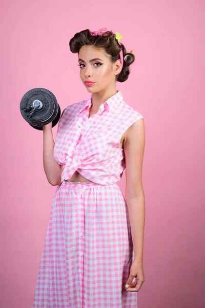 Powerful housewife. pin up woman with trendy makeup. pinup girl with fashion hair. retro woman with dumbbell. Sport. pretty girl in vintage style. strong enaugh — Stockfoto