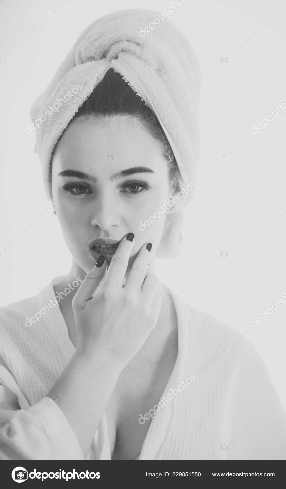 Girl With Towel On Head Relaxing, After Spa Or Morning Shower. Lady With  Mysterious Face And Decollete. Woman In Bathrobe After Wellness And Skin  Care Procedures. Rest, Wellness And And Care Concept.