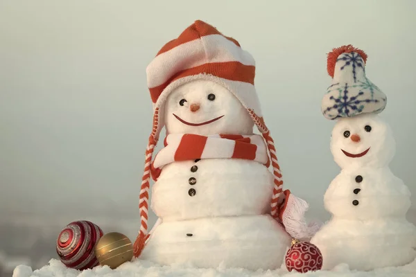 Snowmen in clothing on winter day — Stock Photo, Image