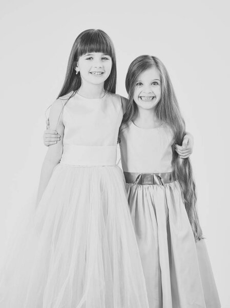 portrait of two girls of girlfriends in dress