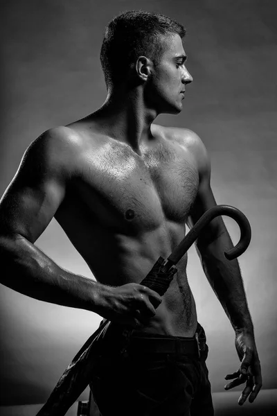 Wet muscular man with umbrella — Stock Photo, Image