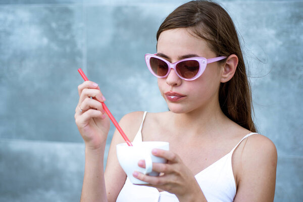 Start the day with great taste. Pretty woman sip beverage with drinking straw. Cute woman drink through straw in cafe. Fashionable woman enjoy sipping drink through straw. Savor the flavor