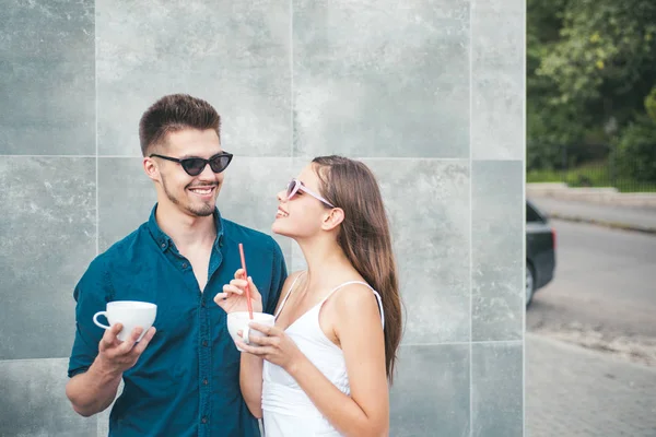 Enjoying the best coffee date. Couple in love drink coffee outdoor. Couple of woman and man with coffee cups. Girlfriend and boyfriend have espresso or latter drink. Grab a coffee