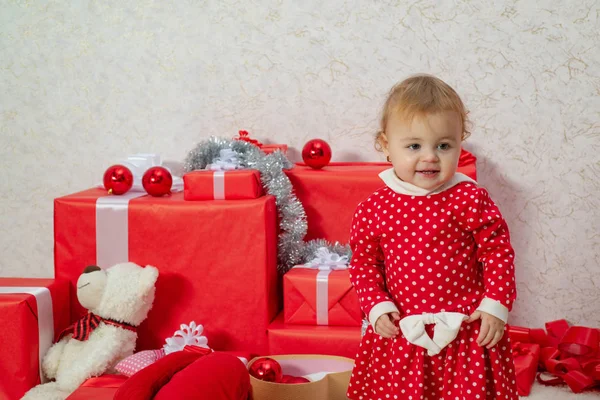 Happy children. Celebraties concept. Cute babies with a red present box on white background. Cute little child hold gift box. — Stock Photo, Image