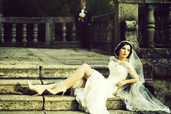 Bride sitting on stairs