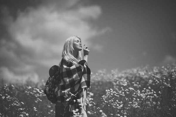 Spring, woman in chamomile field. Chamomile flower, nature and environment. Summer vacation, wanderlust, spa. Womens day, mothers day, beauty. Sensual woman in blossoming flower field spring