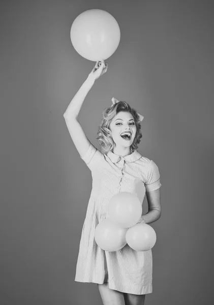 Pin up woman in balloons, birthday.