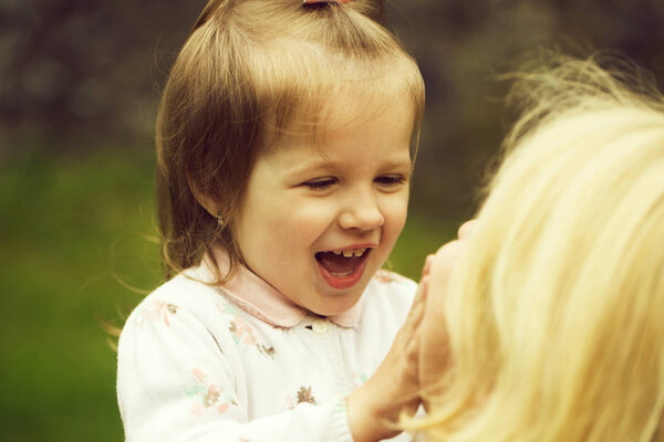 Happy mother with little girl