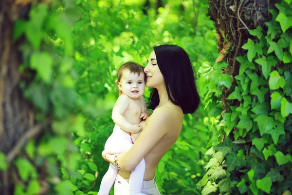 Baby and mother hugging topless — Stock Photo, Image