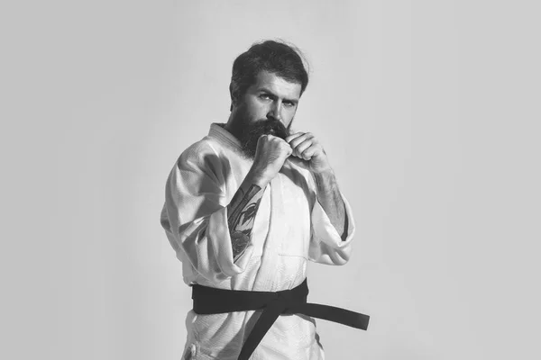 Bearded karate man, brutal caucasian serious hipster in kimono — Stock Photo, Image