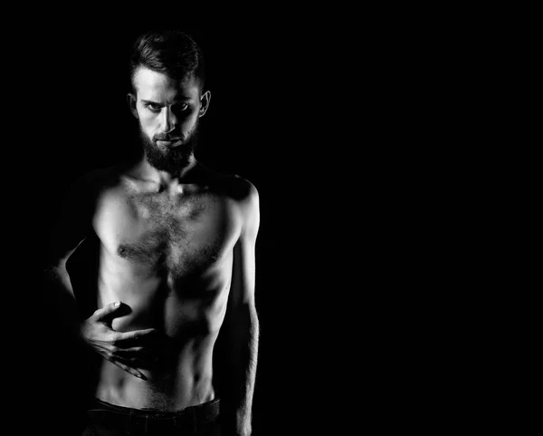 Slim bearded man with thin bare torso isolated on black — Stock Photo, Image