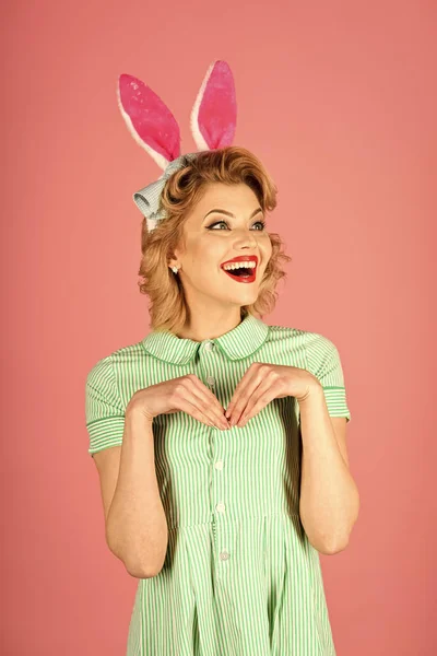 Beauty, fashion, cosmetics, vintage style. Easter, makeup, pinup party, girl in rabbit ears. Pinup woman, vintage, look. Retro woman in bunny ears, easter Sexy blond girl with retro makeup playboy