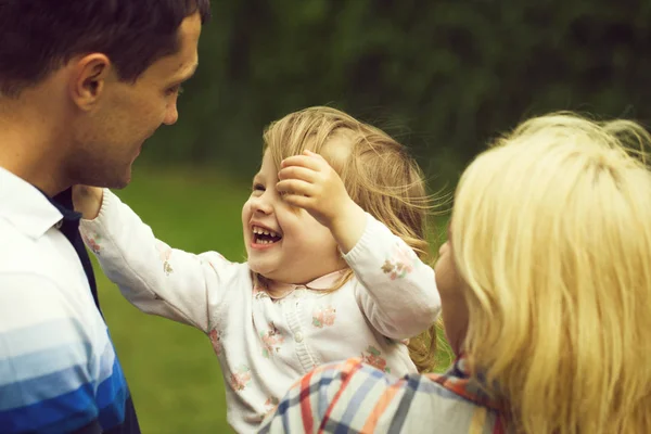 Happy parents with little girl — Stock Photo, Image